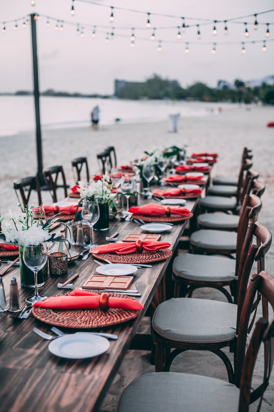 Elegantly set long dinner table outdoors, representing bespoke Make a Wish experiences
